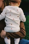 Littlie Organic Long Sleeve Zip Romper, MILK/CHRISTMAS ICONS - example image 2
