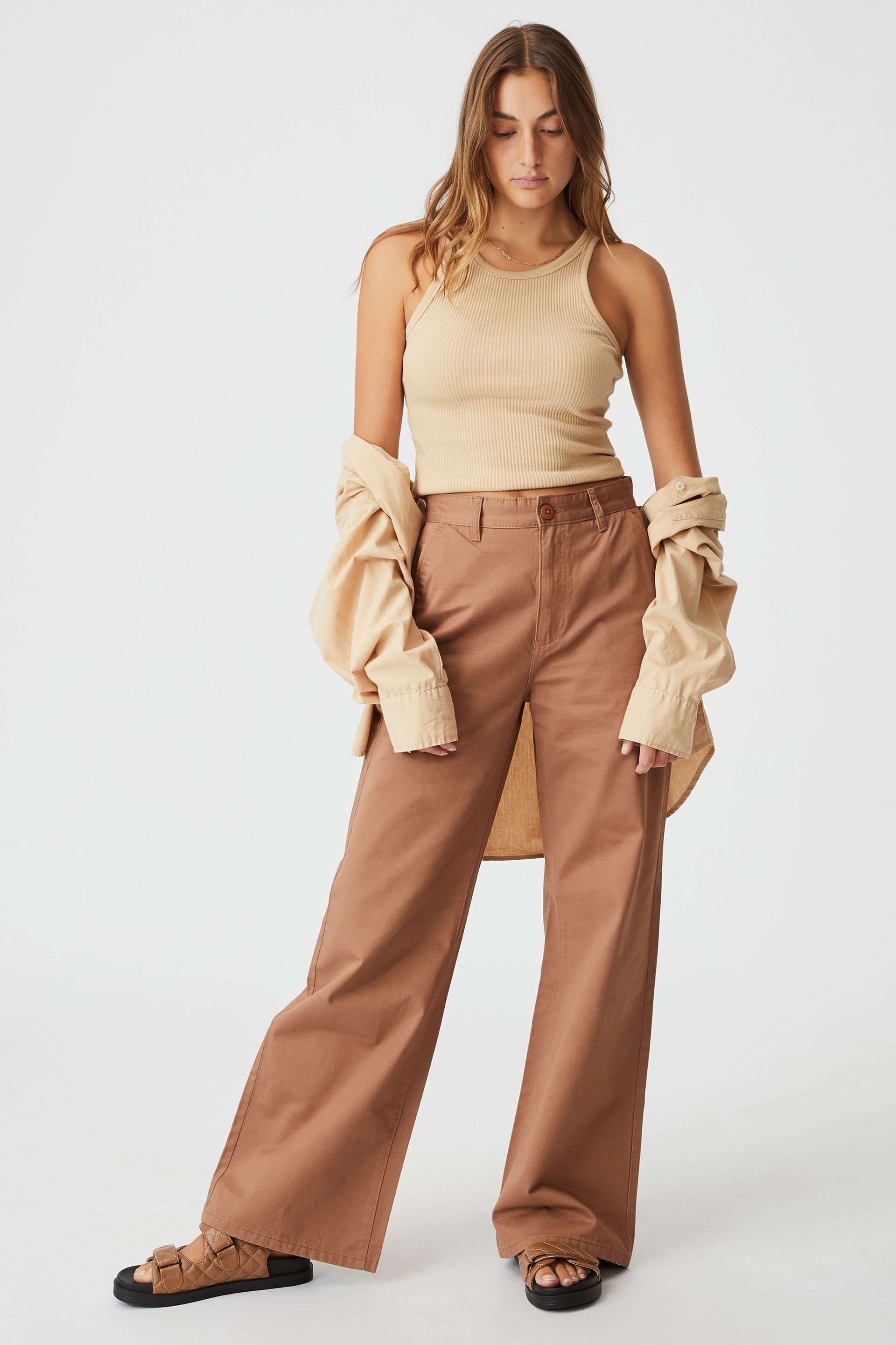 Long trousers produced with royalties beige dark | Calliope