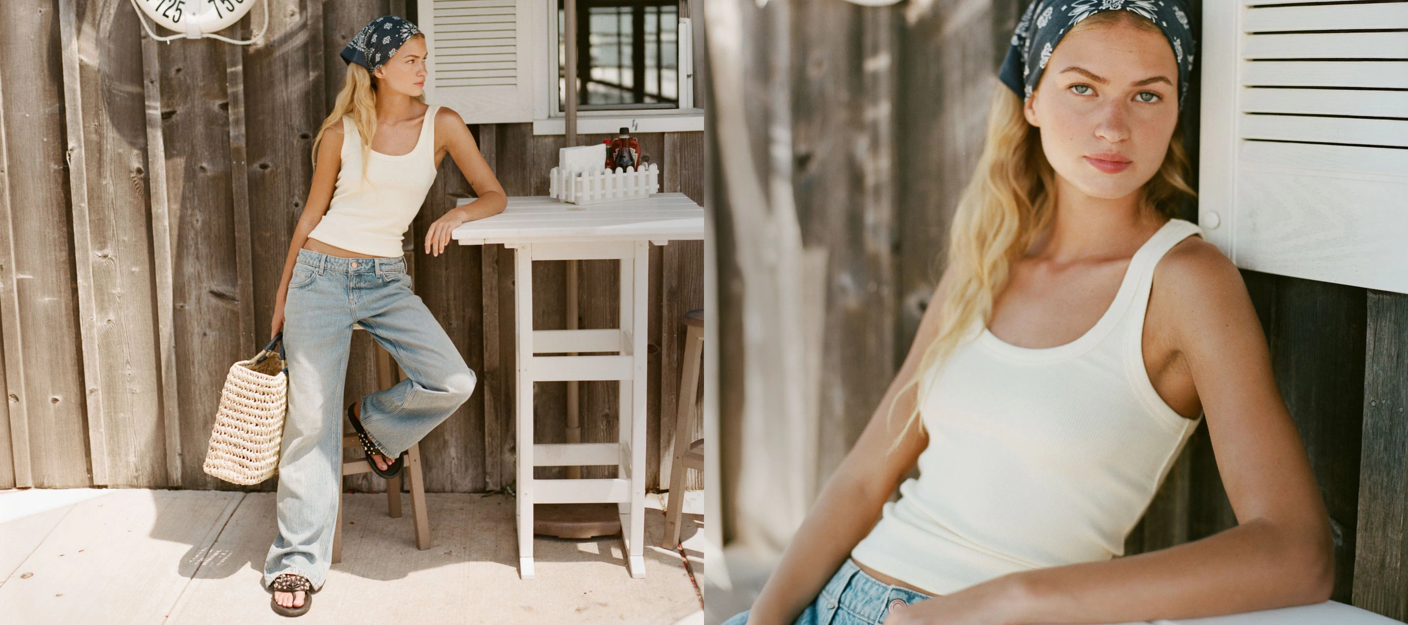 Woman wearing white tank top and light blue jeans with navy bandana headwrap, holding woven tote bag in rustic wooden setting