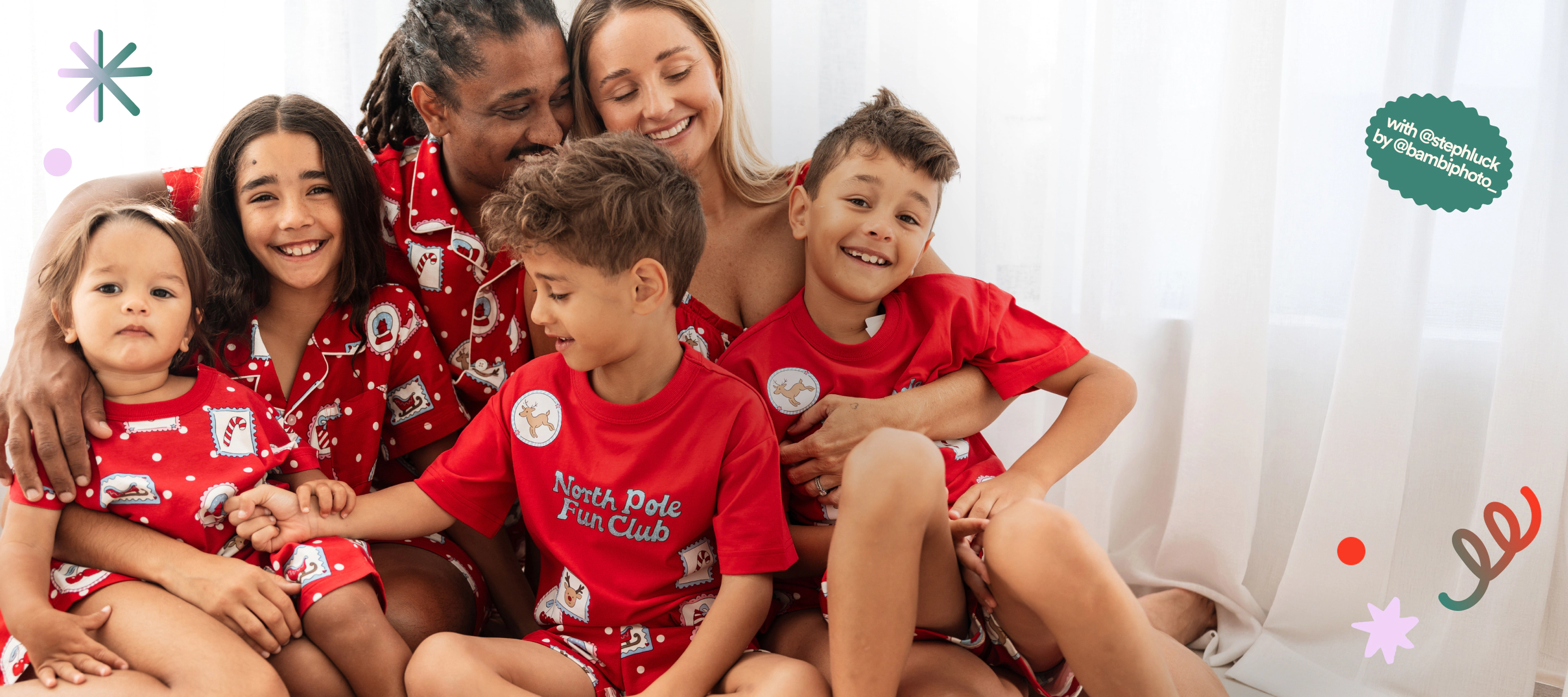 Family with matching christmas pyjamas