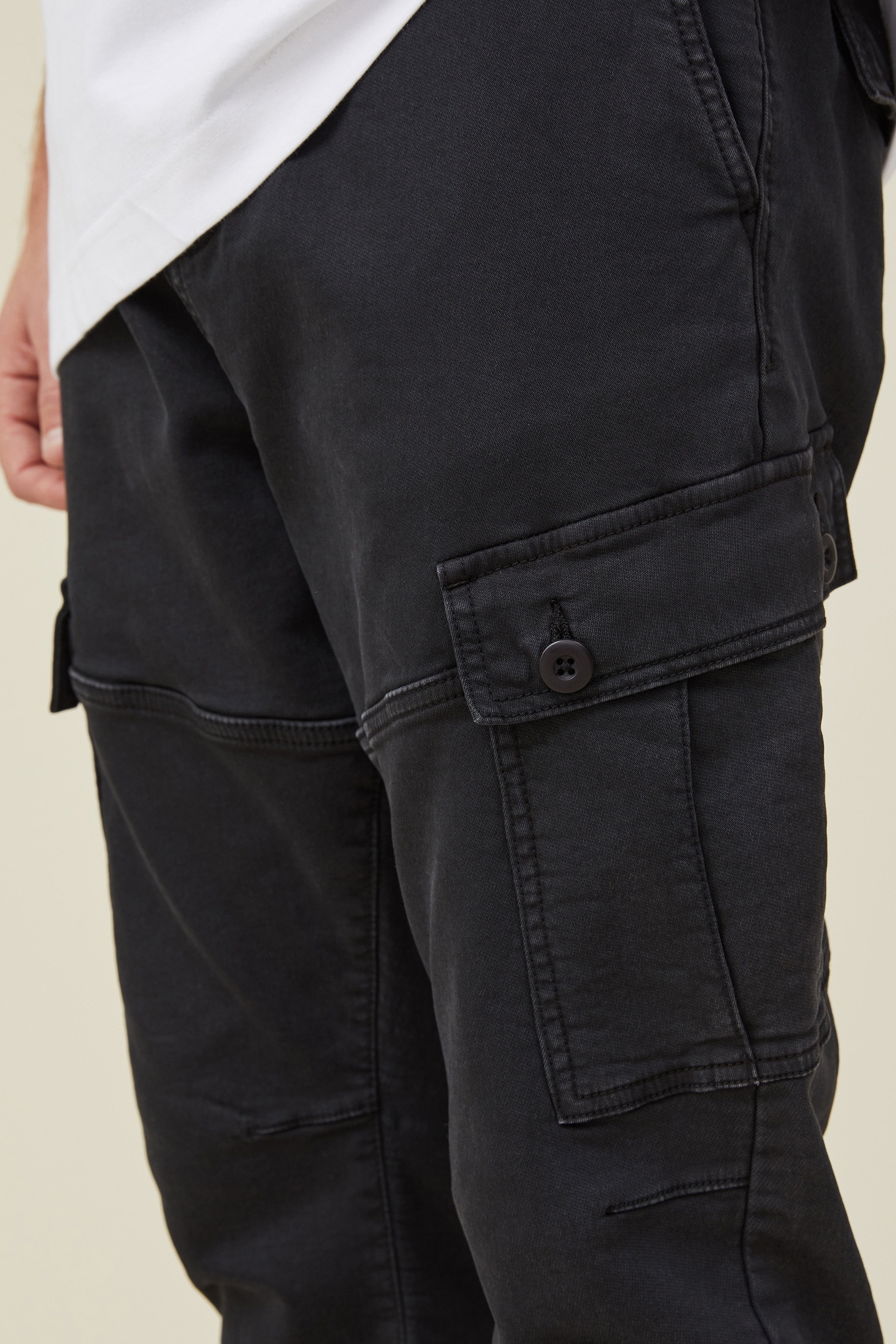 Black slim fit cuffed cargo trousers | River Island
